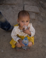 Little girl with a shaven head, Yarkand